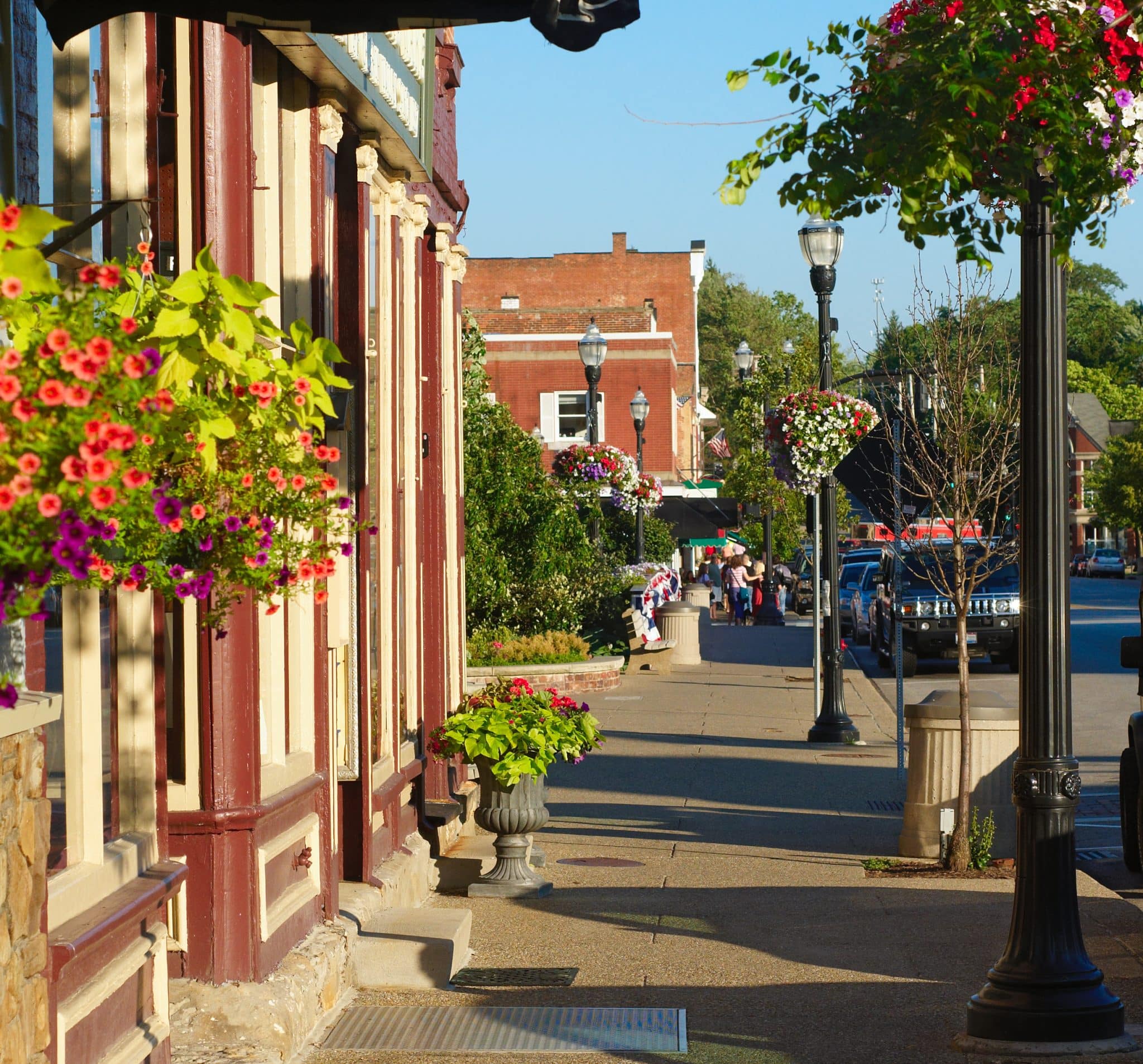Colorful sidewalk with quaint shops and flowers Colorful sidewalk with quaint shops and flowers