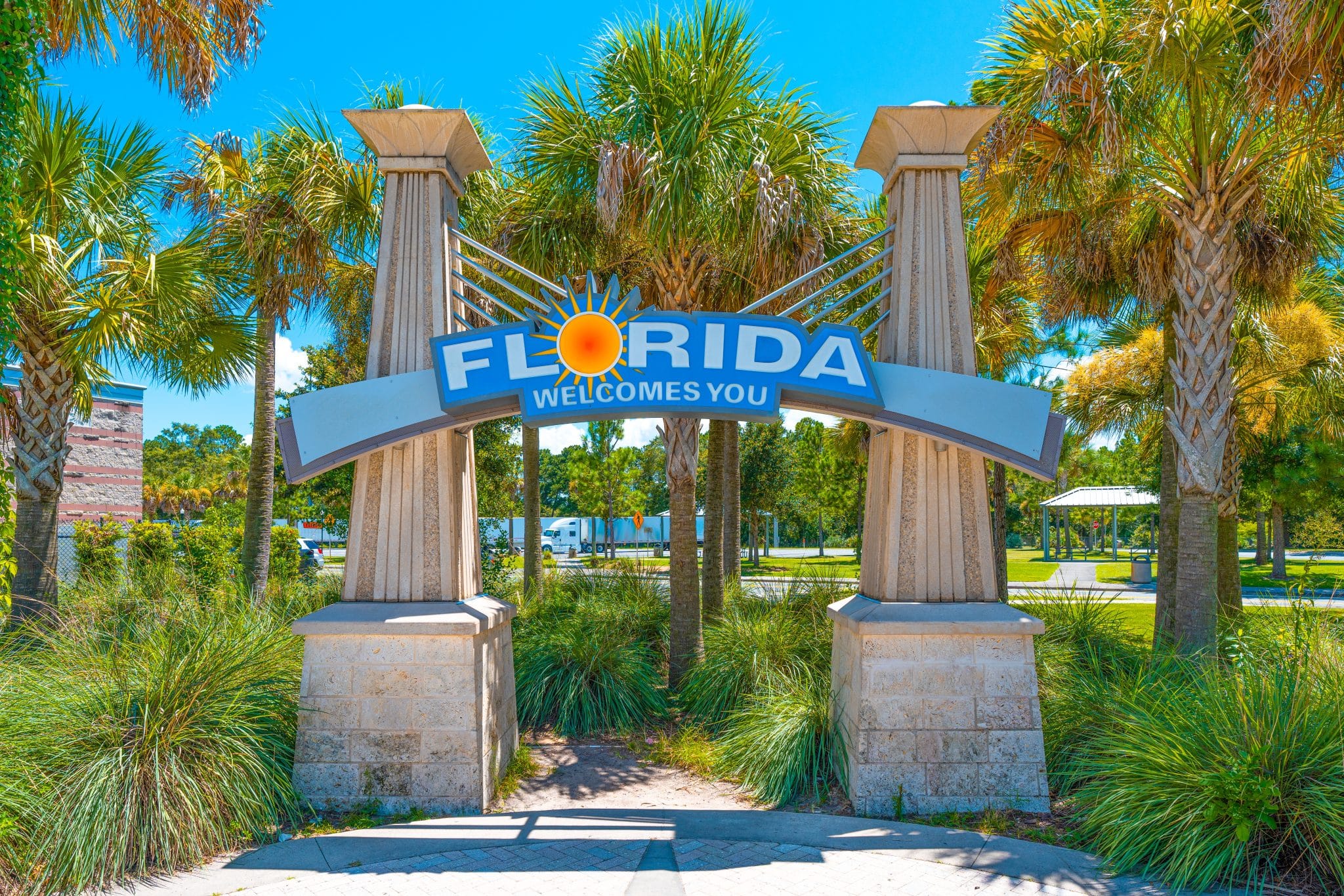Florida. Florida welcome center in rest area or rest stops for cars and trucks. FL sunshine state. United States of America. Florida Welcomes You sign. Vacation trip. Palm Trees. Visitor center.