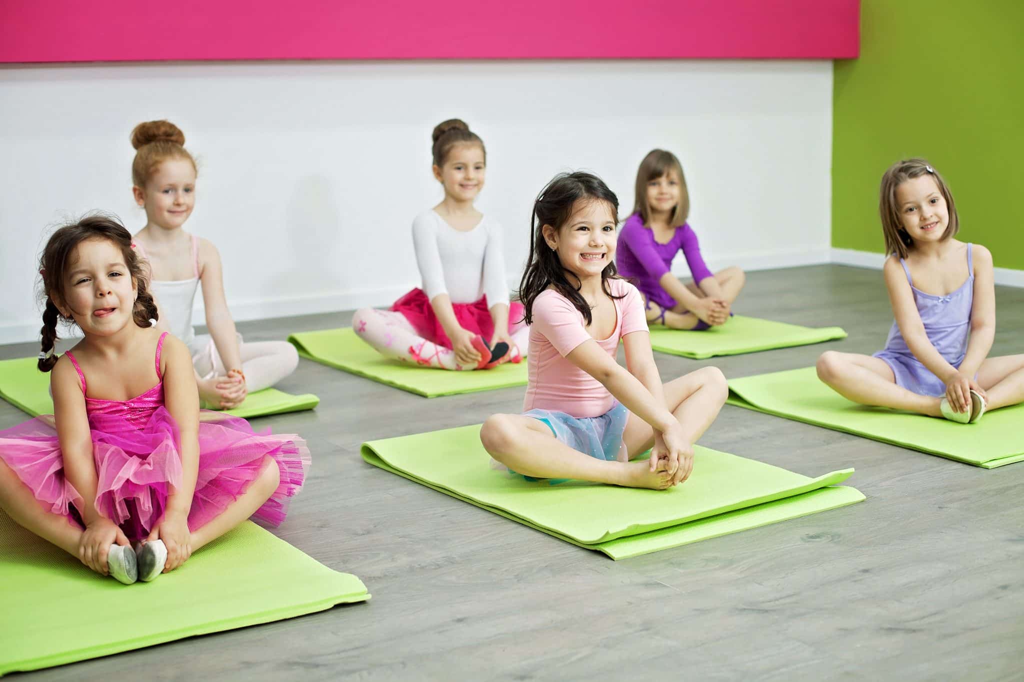Little girls doing stretching exercise
