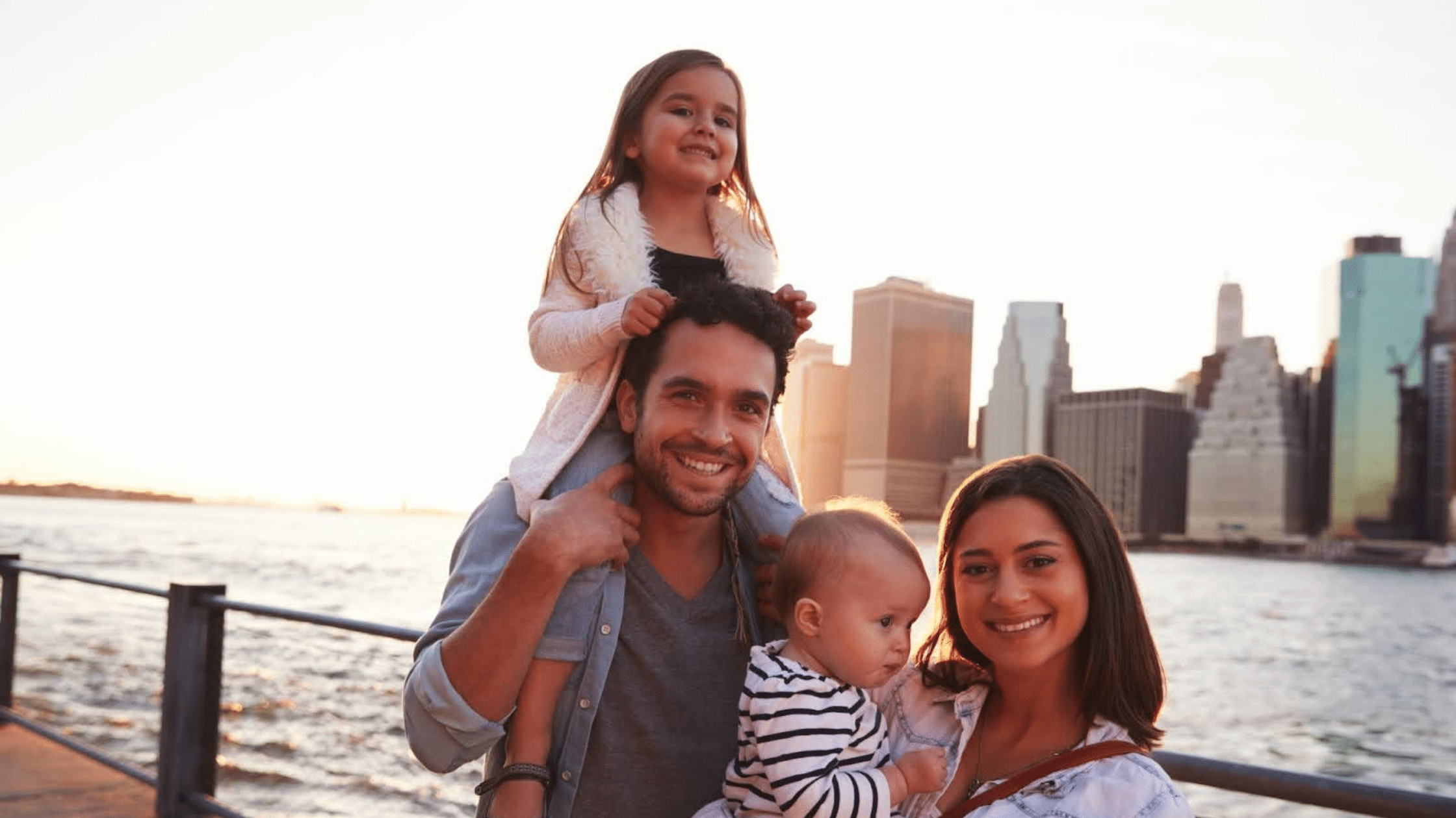 Happy family and New York skyline Happy family and New York skyline