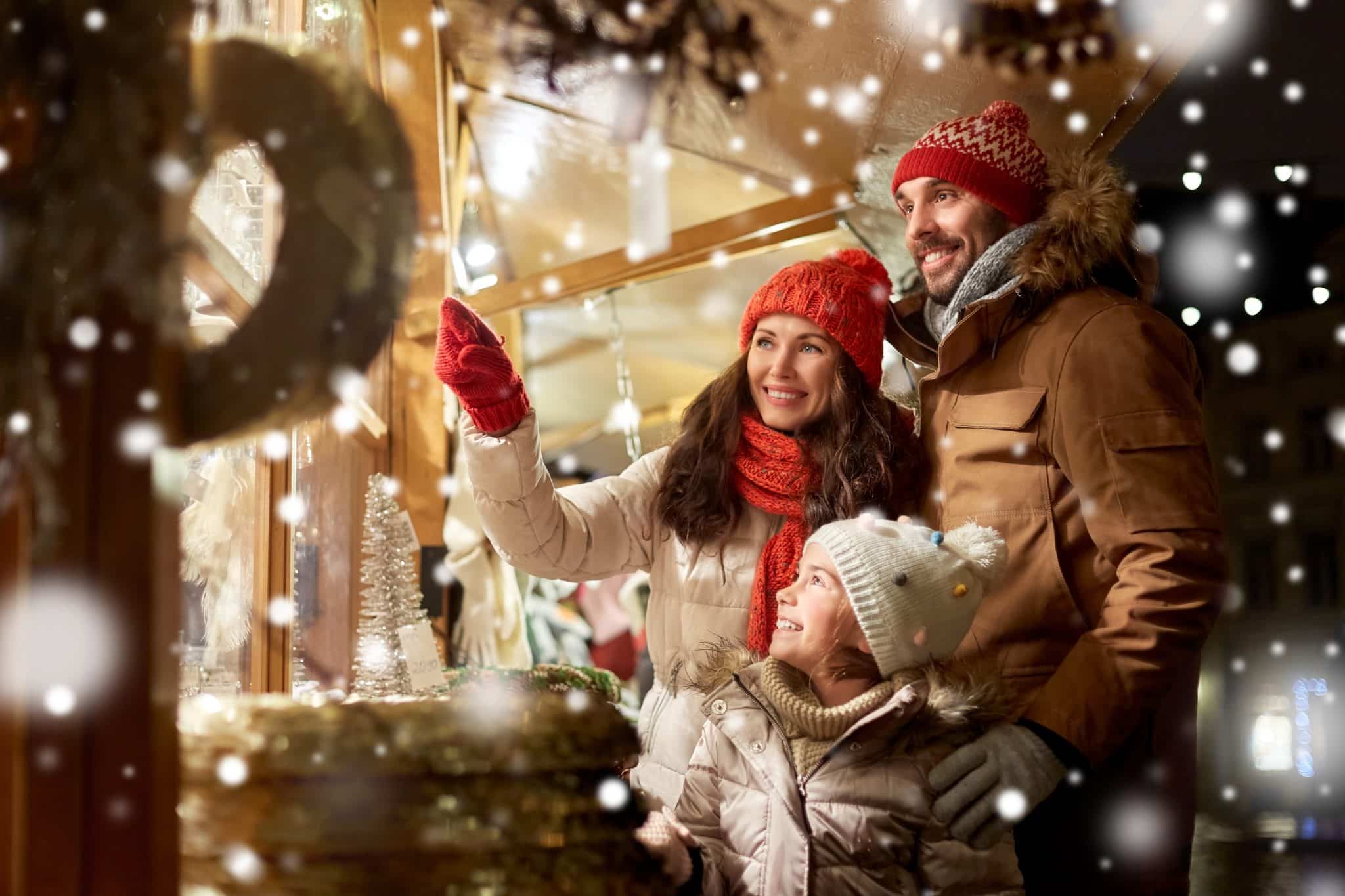 Happy family at Christmas market in city Happy family at Christmas market in city