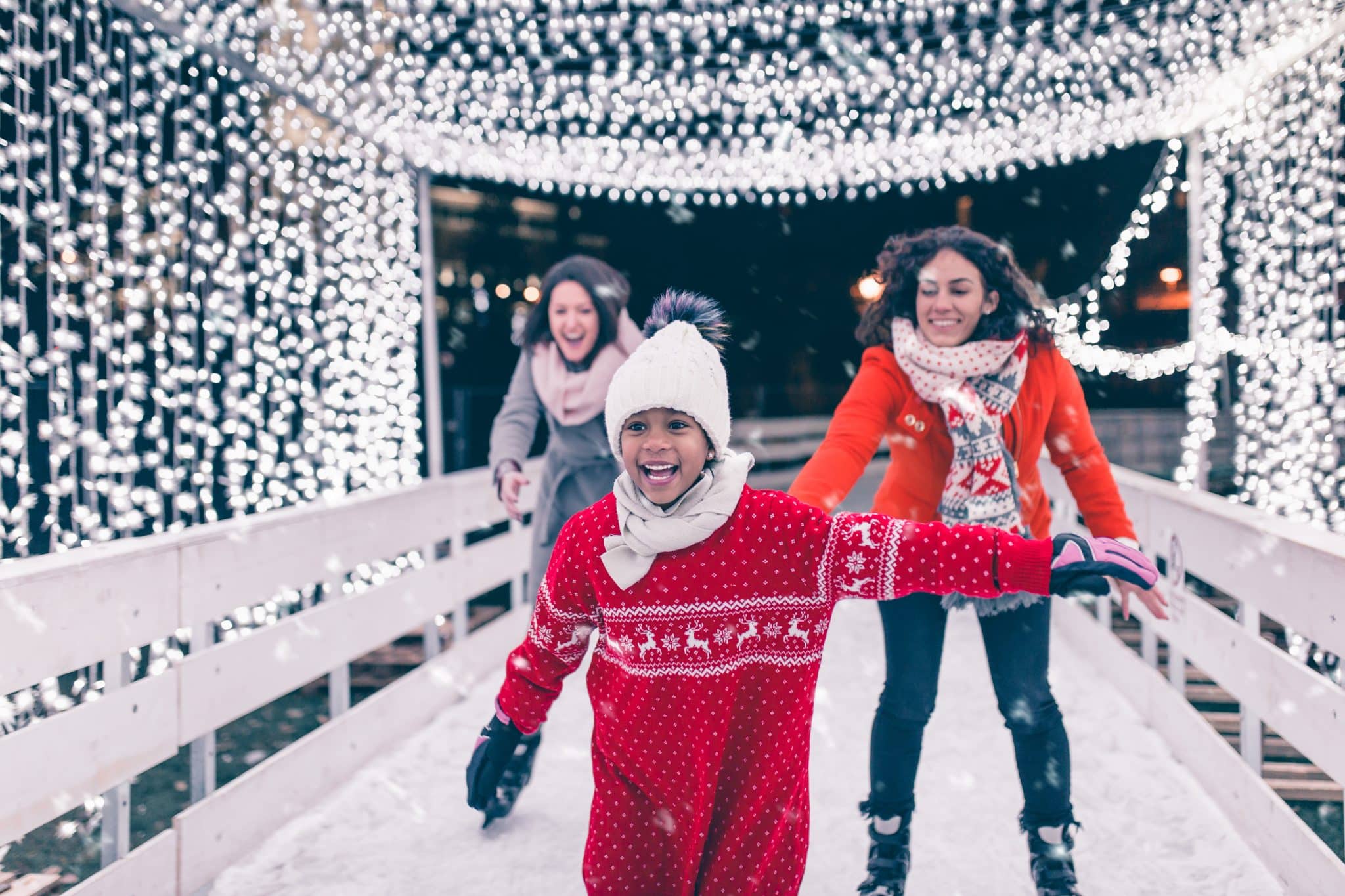 Mother with her daughter and friend enjoying ice skating. Mother with her daughter and friend enjoying ice skating.