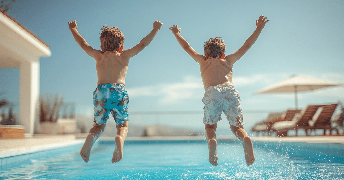 Kids Jumping into a Pool in Florida Two young boys jumping into a swimming pool on a sunny day in the Florida suburbs