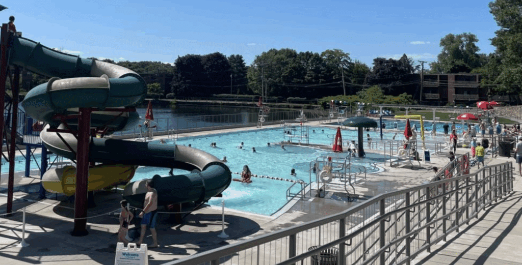 Outdoor pool and water slides at the Rosemary Recreation Complex in Needham, MA