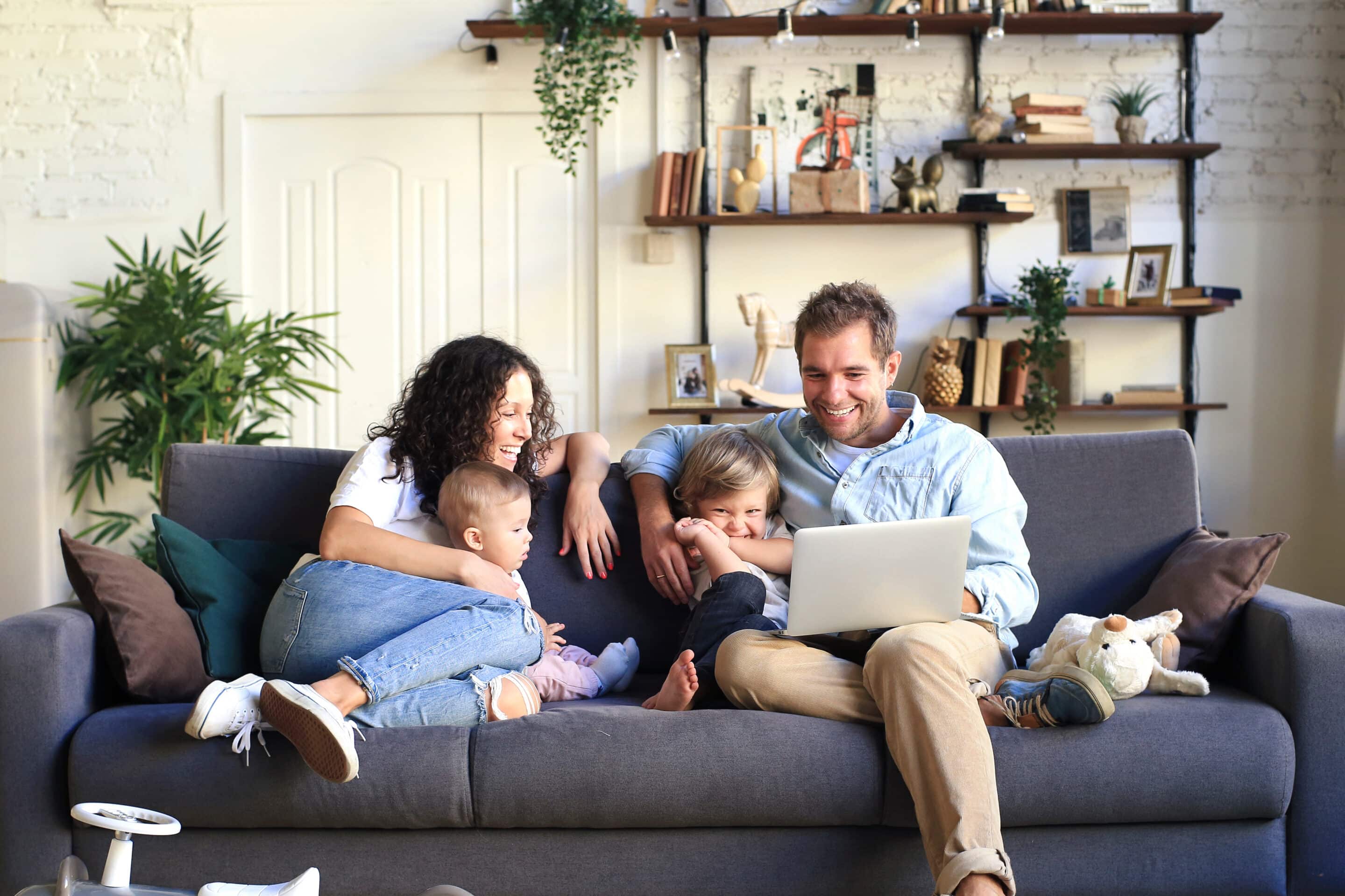 City Family Considering a Move to the Suburbs City family exploring a move to the suburbs while sitting together at home